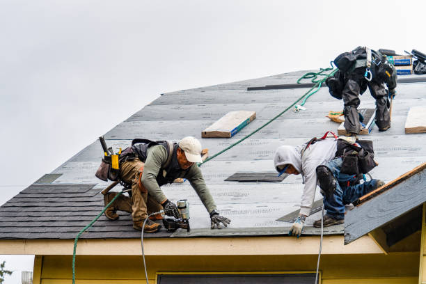 Professional Gutter Installation technician working in Walpole, MA